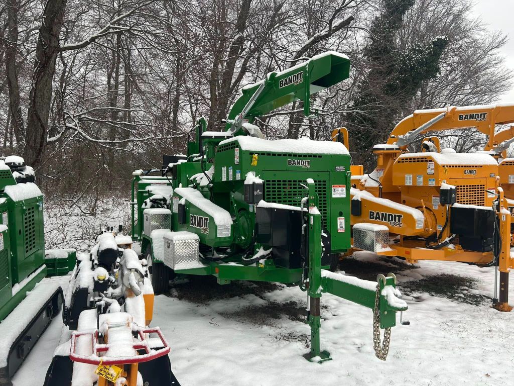 Lineup of Bandit wood chipper equipment owned by Garrison's Tree Service