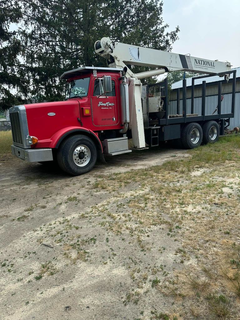 Garrison's Tree Service red National crane truck